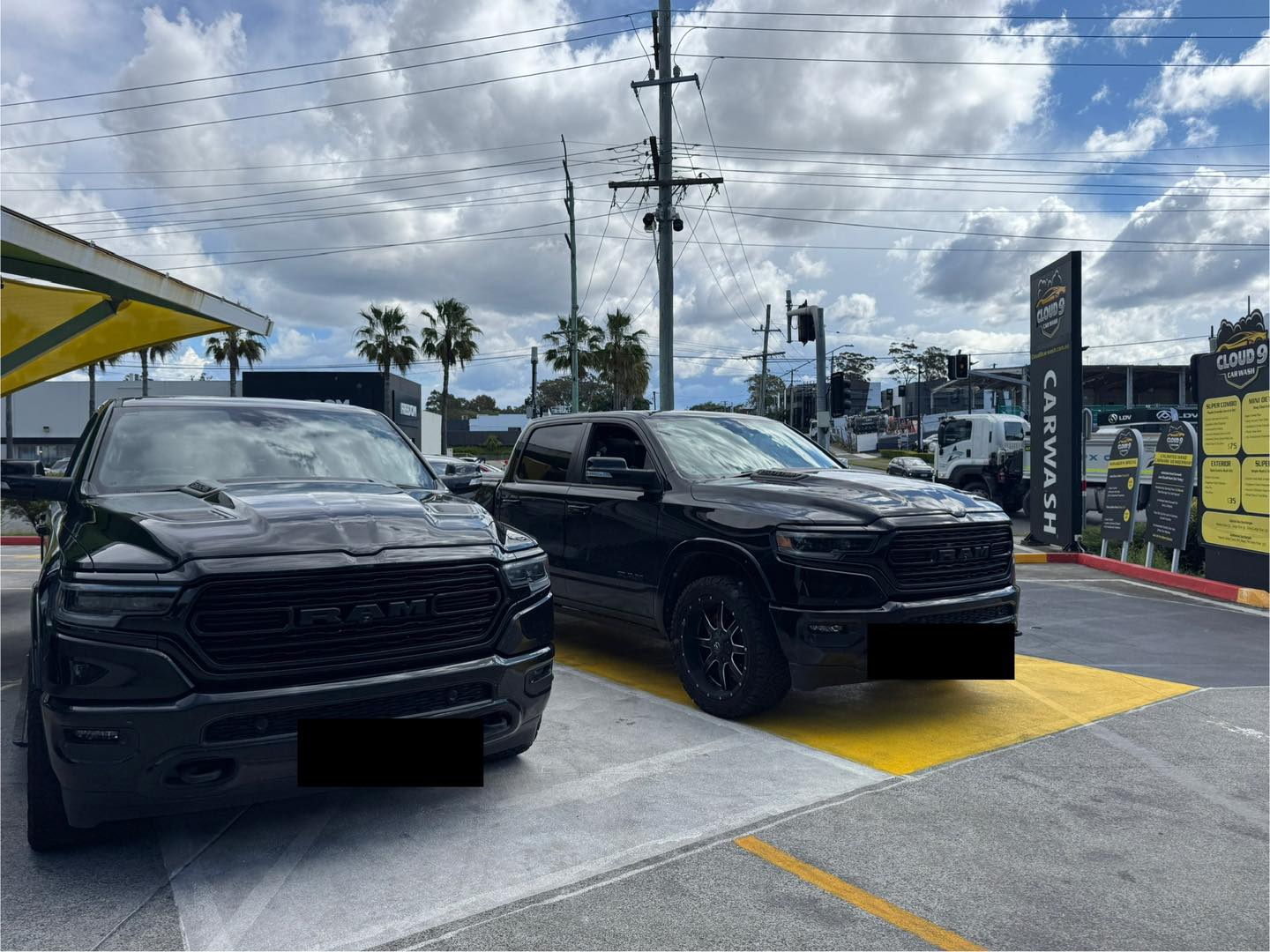 Cloud 9 hand carwash crew washing wheels on Ferry Road Southport Gold Coast