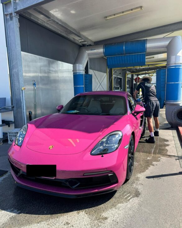 Cloud 9 hand carwash crew washing wheels on Ferry Road Southport Gold Coast