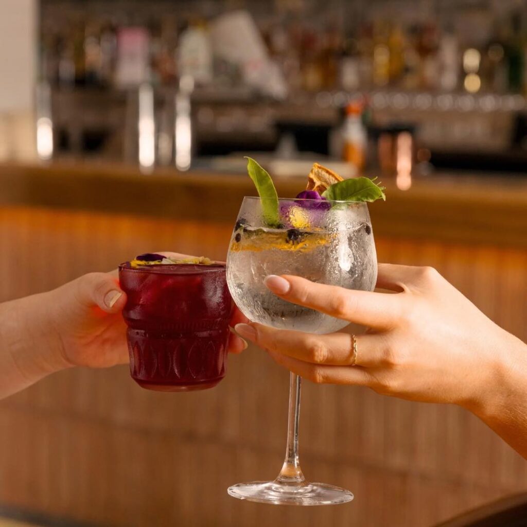 Colorful signature cocktails on the bar at CORA, the best cocktail spot in Broadbeach.