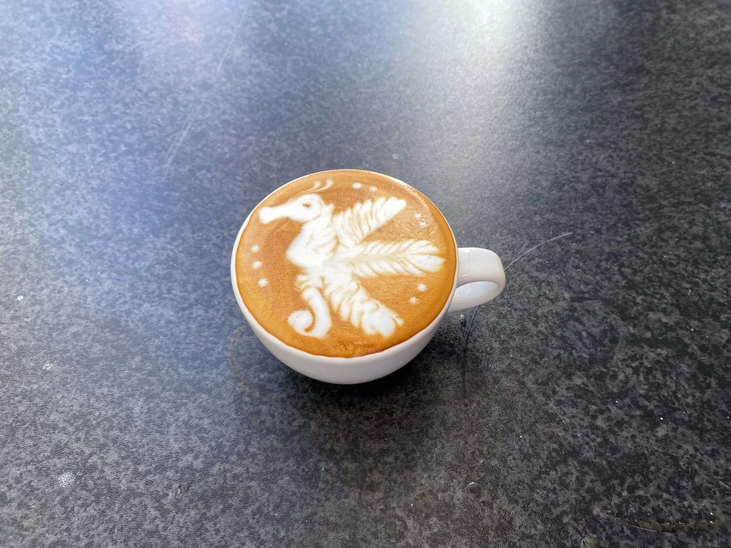 Freshly poured flat white made by a barista course graduate