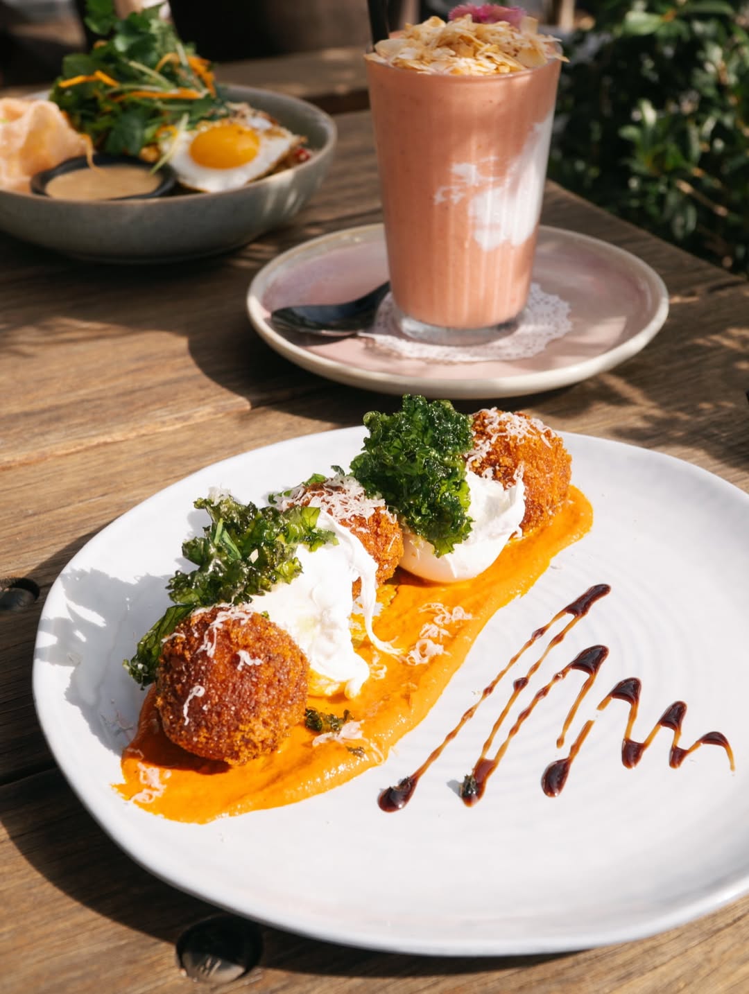 The Arc at Nobbys café people enjoying coffee at a café in Nobby Beach