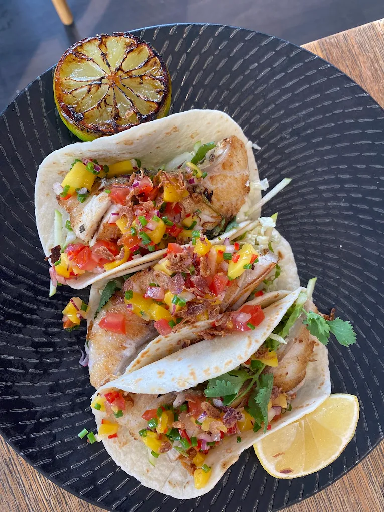 Fish Tacos with grilled wild barramundi and mango salsa at Sunset on Chevron, Chevron Island