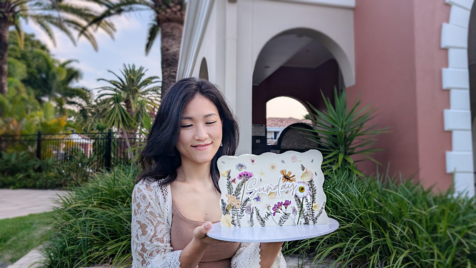 Heya from Yum Bakery Mermaid Beach holding custom celebration cakes