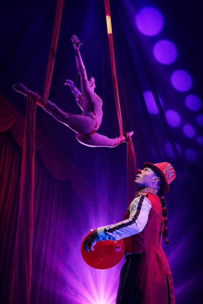 Aerial acrobat performing above the crowd at Ashton's Great Australian Circus