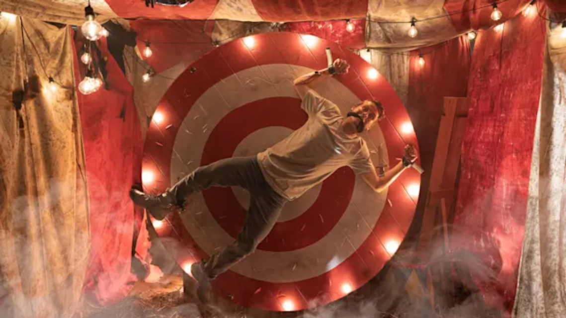 Sir Smiles-a-lot lurking in the burnt ruins of Sable Bros. Smile Time Circus