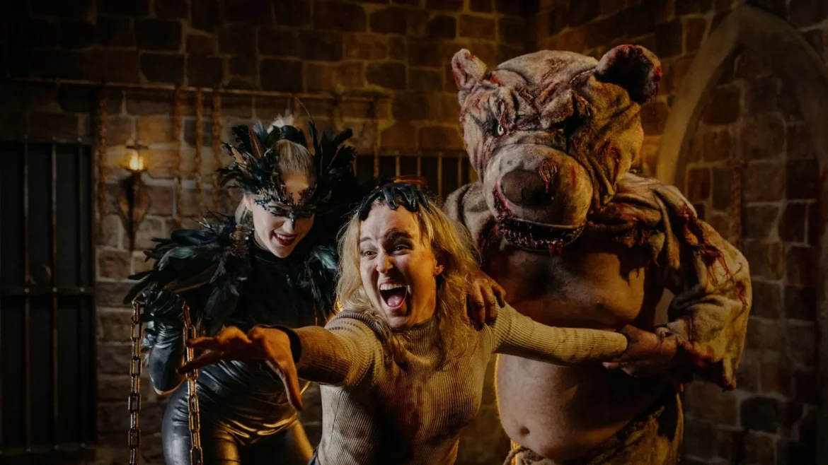 Guests captured and restrained by a roaming monster at Fright Nights